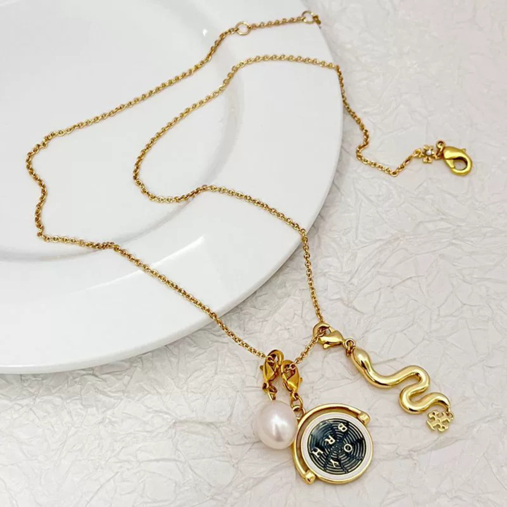 Tory Burch Freshwater Pearl Gold Plated Serpent Flip Disc Multi Pendant